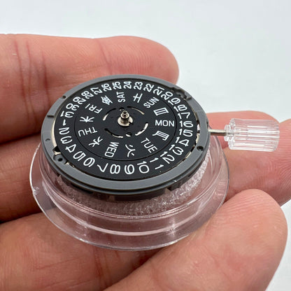 Miyota NH36A black-finish watch movement dial with green lume, featuring 3 crown positions for accurate time adjustment.