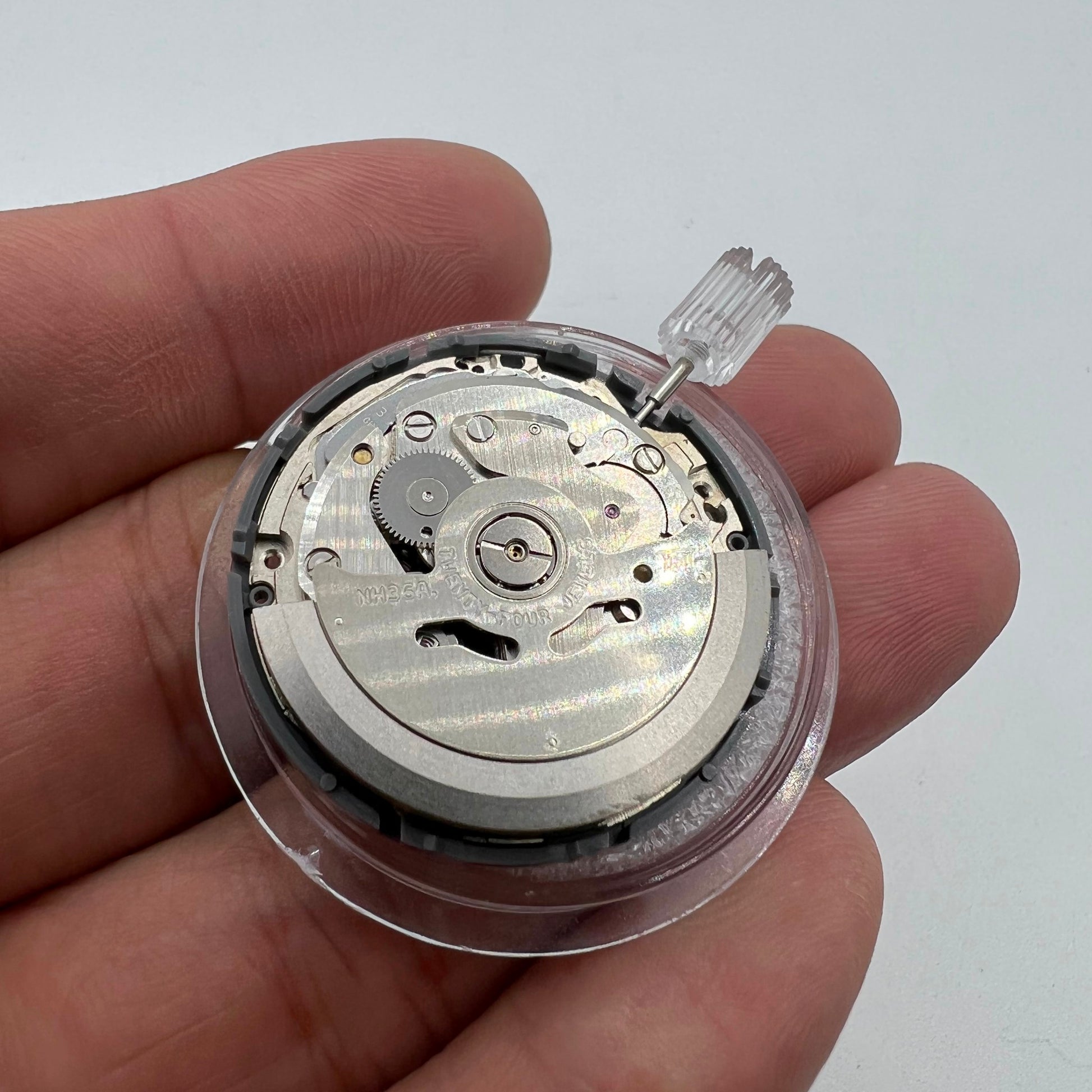 Miyota NH36A watch movement with black finish, green lumed dial, and 3 crown positions for precise adjustments.