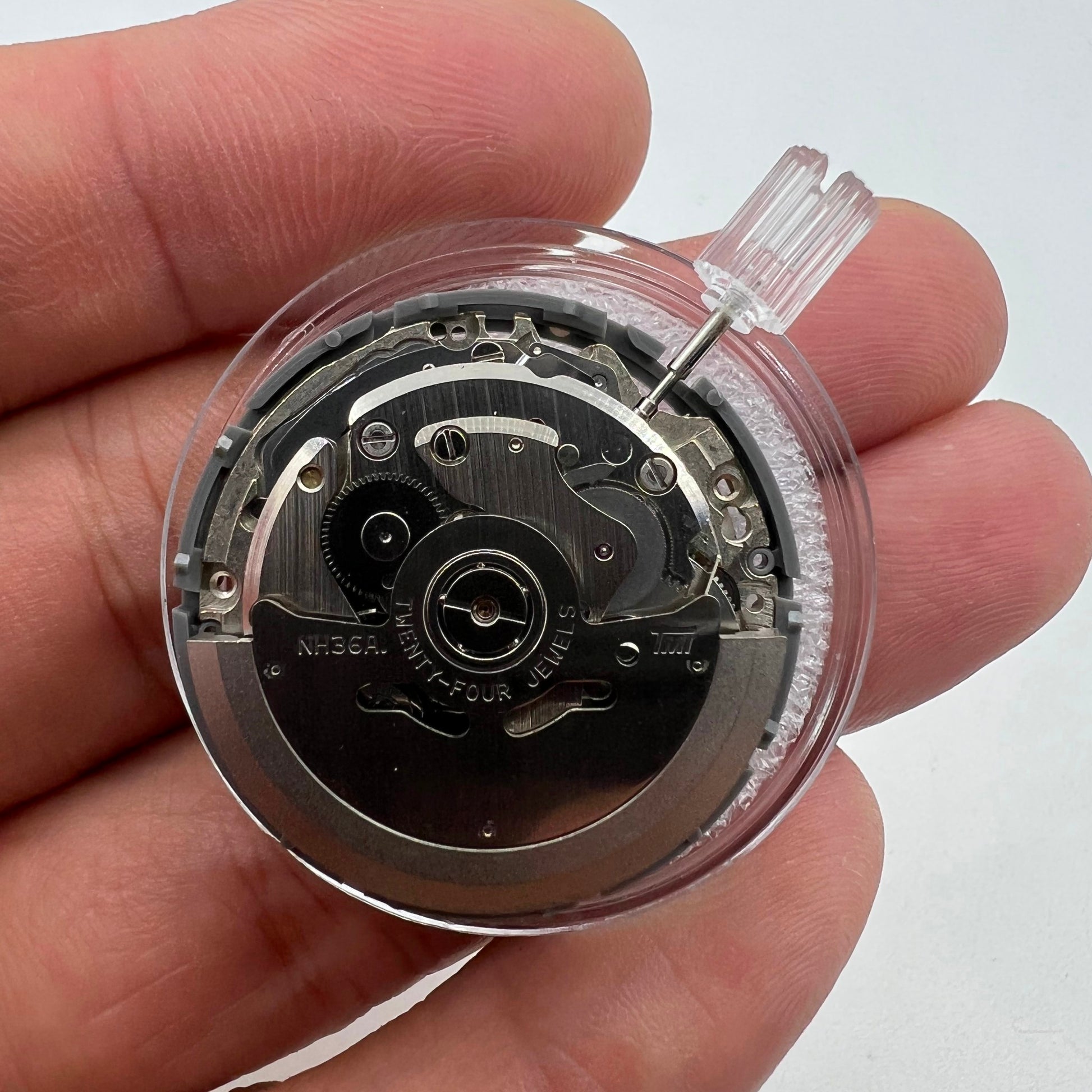 Miyota NH36A automatic watch movement with black finish, green lume, and 3 crown positions for precise timing.