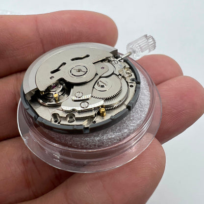 Miyota NH36A black watch movement with green lume, featuring 3 crown positions for accurate time adjustments.