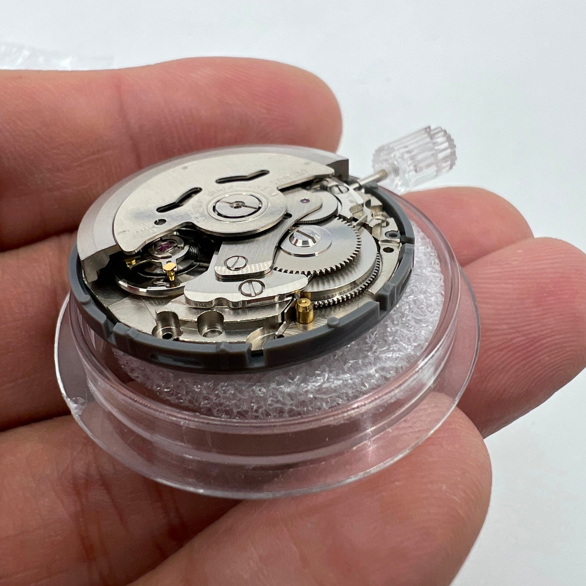 Miyota NH36A automatic watch movement with black finish, green lume, and three crown positions for precise timing accuracy.