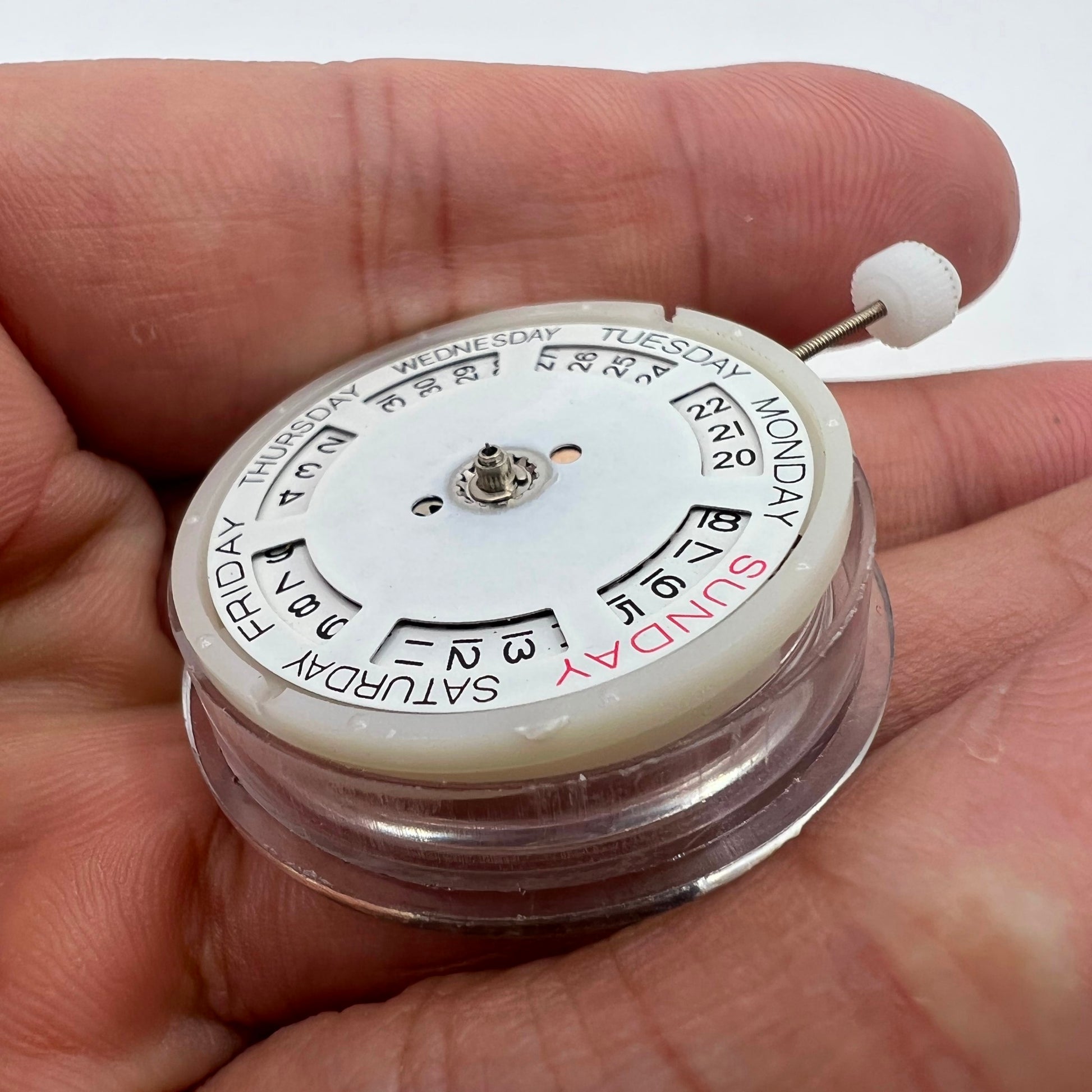 Silver automatic watch by MINGZHU with 2813 mechanical movement, date and day display functions.