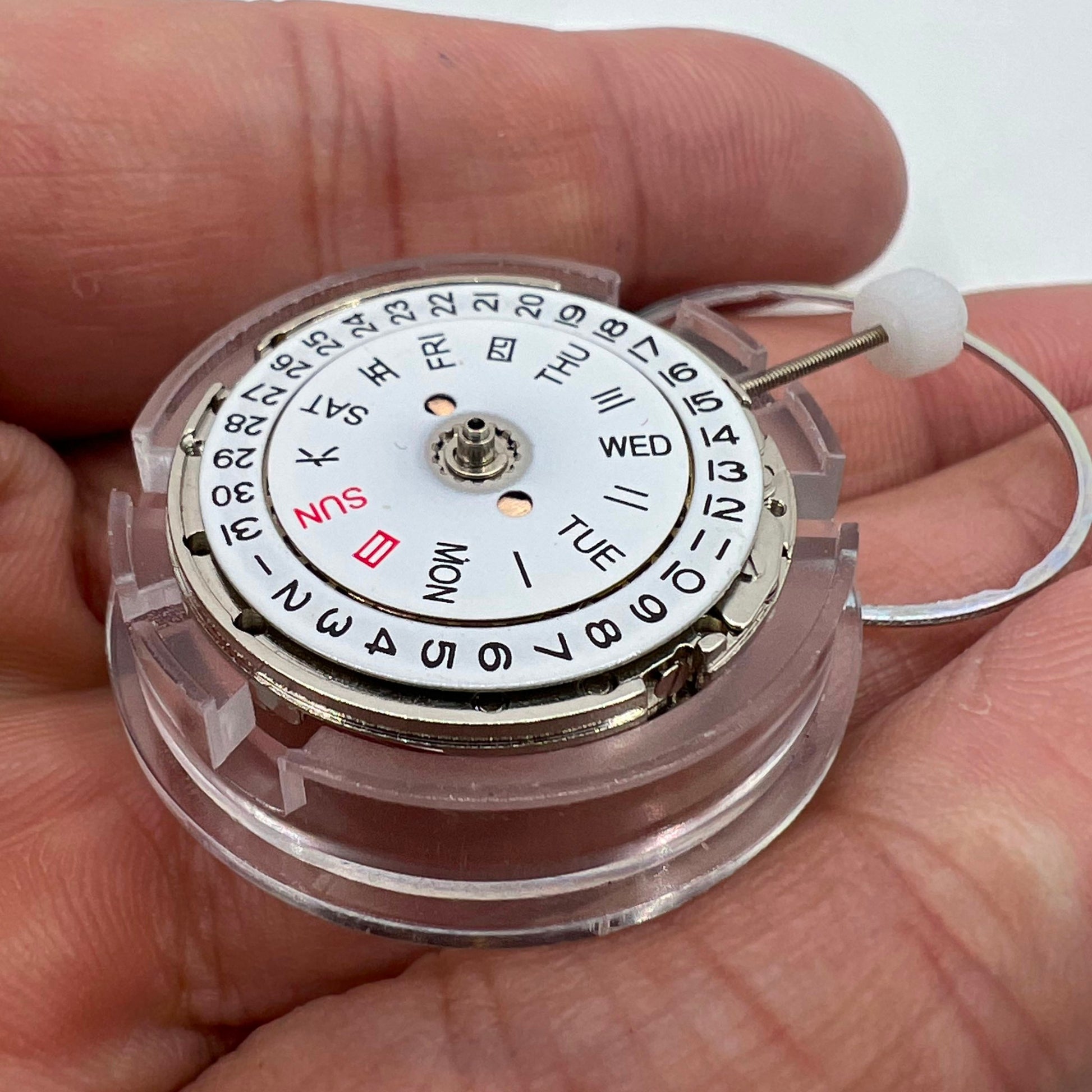 DG2813 automatic watch movement with visible mechanical gears and day-date display, ideal for replacements.