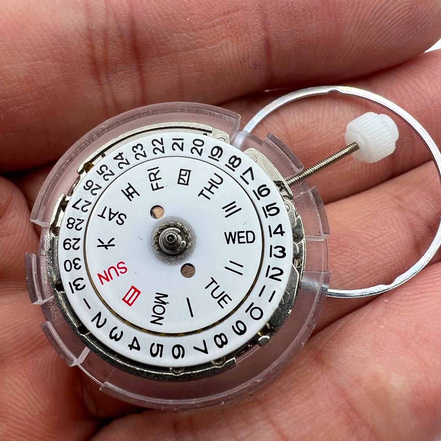 DG2813 automatic watch movement displaying intricate mechanical gears and day-date function for replacement parts.