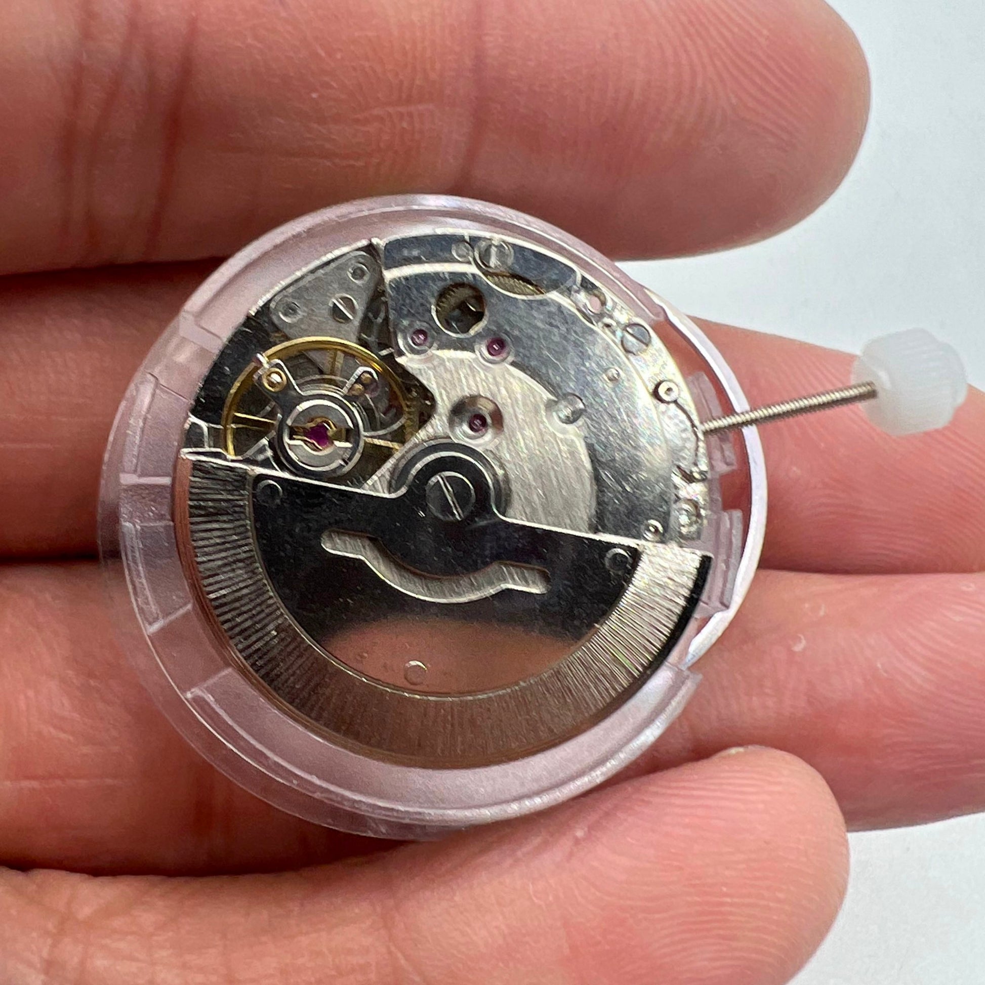 DG2813 automatic watch movement displaying intricate mechanical gears and day-date function for replacement parts.