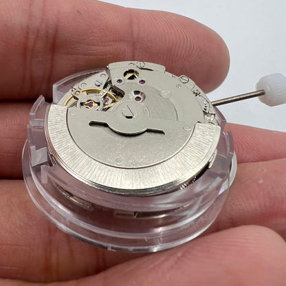 DG2813 automatic watch movement with intricate mechanical gears and clear day-date display for replacements.