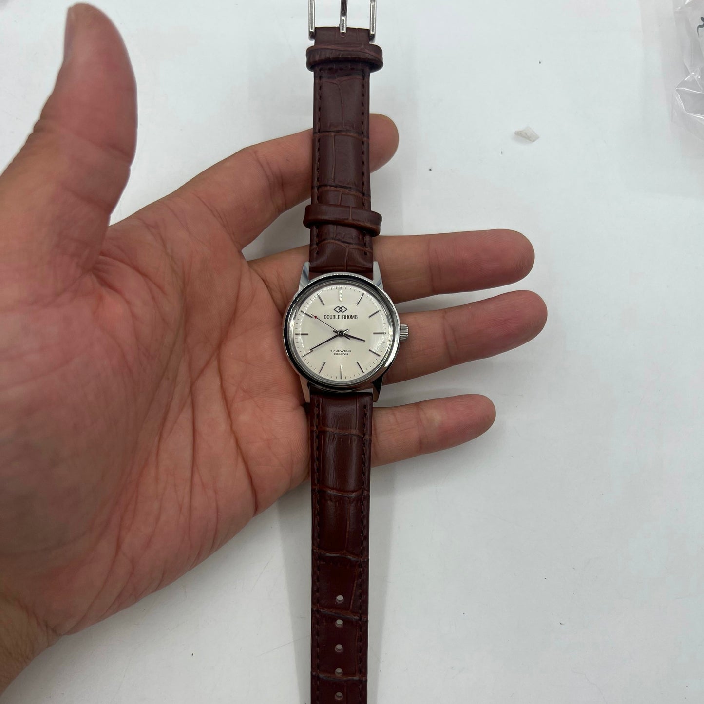 Beijing 36mm Double Rhomb watch with silver case and manual mechanical movement, silver nail markers.