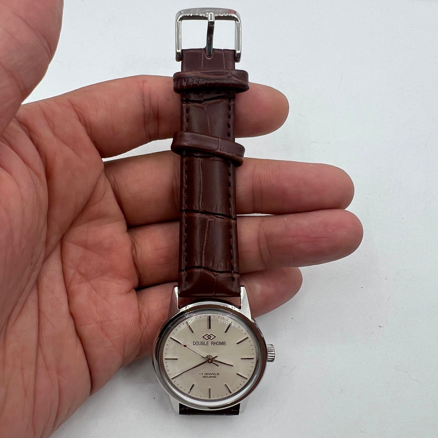 Beijing 36mm Double Rhomb watch with silver case and manual mechanical movement, silver nail markers.