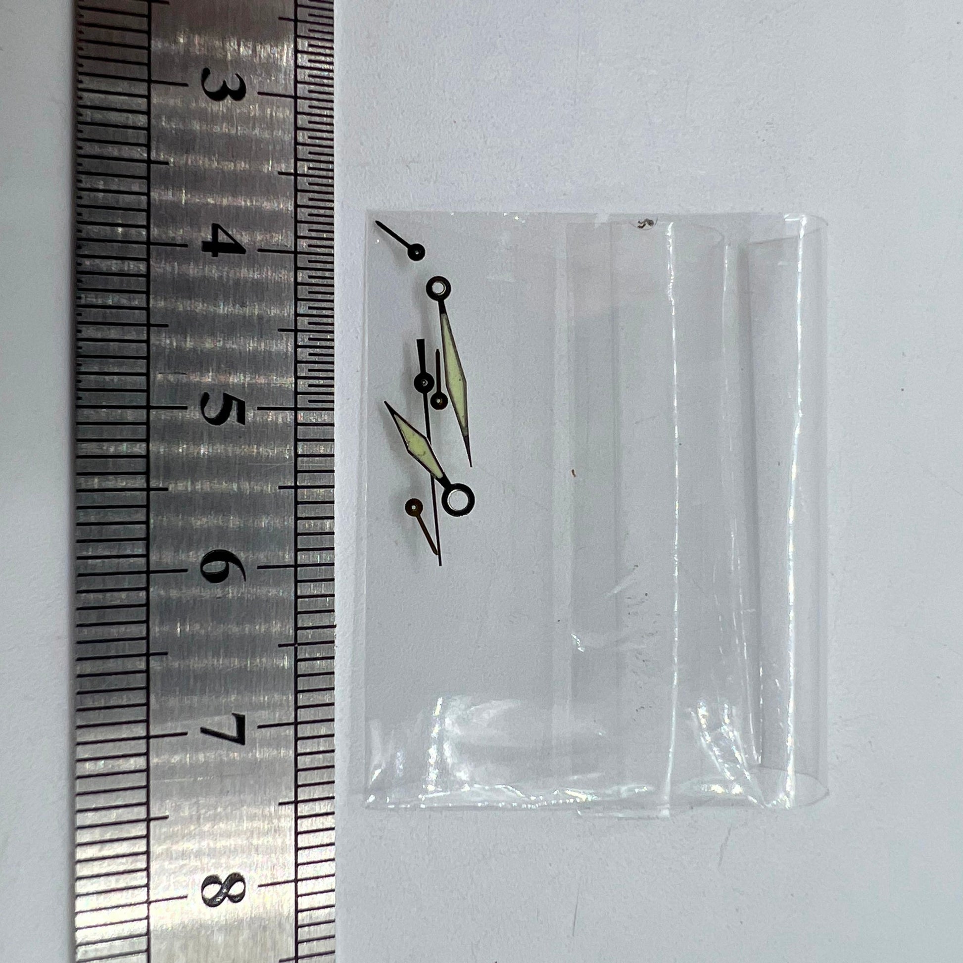 Silver-trimmed green lume watch hands for Miyota OS60 movement, sized 15x13x9mm for precise timekeeping.