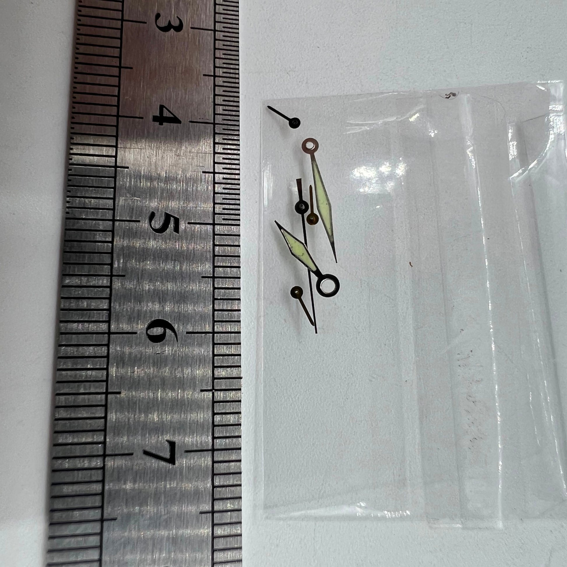 Silver-trimmed green luminous watch hands for Miyota OS60, precise fit 15x13x9mm.