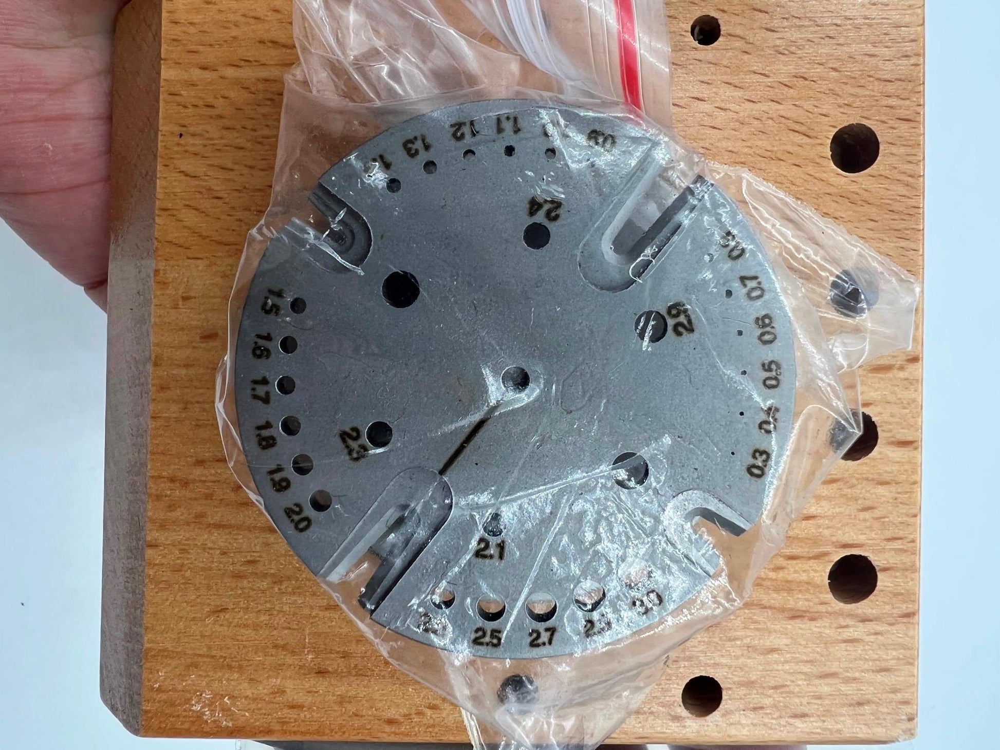 Precision watch balance staff remover and hairspring installer tool for accurate watch repairs.