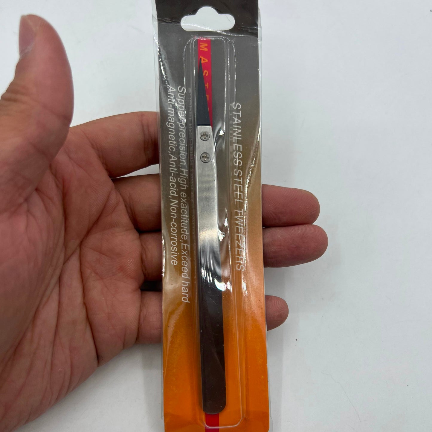 Stainless steel Carbon Fiber tweezers for precise watch repair tasks.