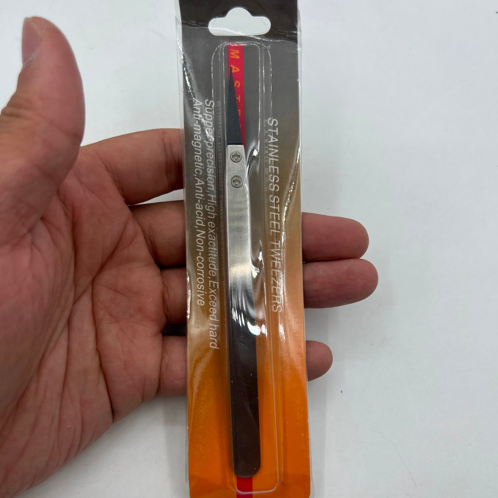 Stainless steel Carbon Fiber tweezers for precise watch repair tasks.