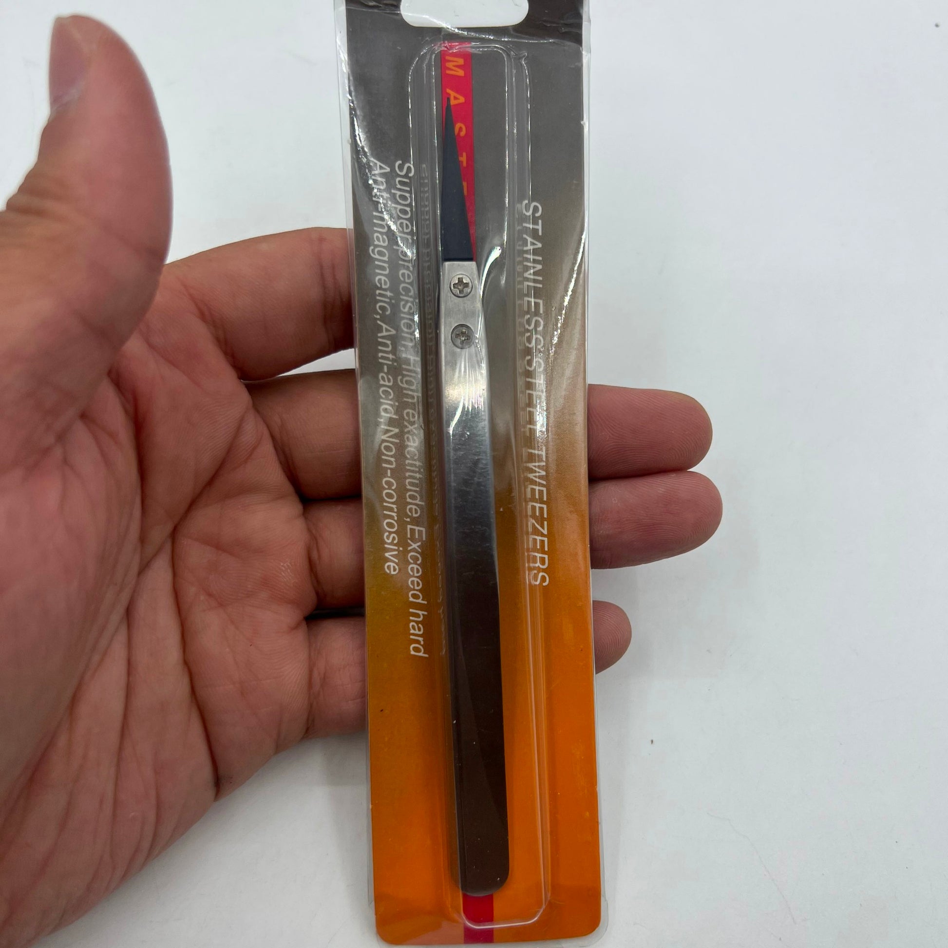 Stainless steel carbon fiber tweezers for precise watch repair tasks.