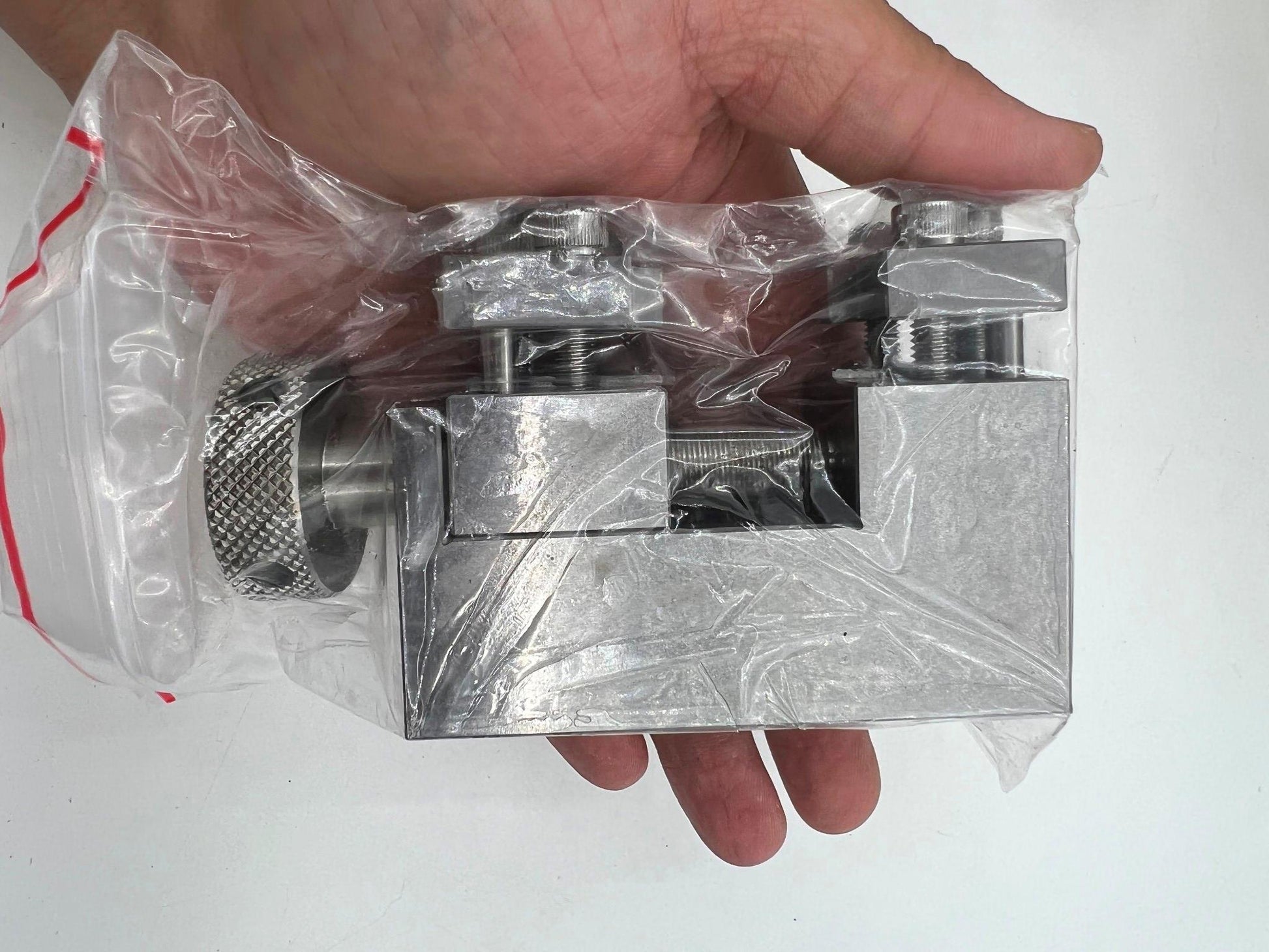 Oyster style stainless steel link remover for precise watch band adjustments