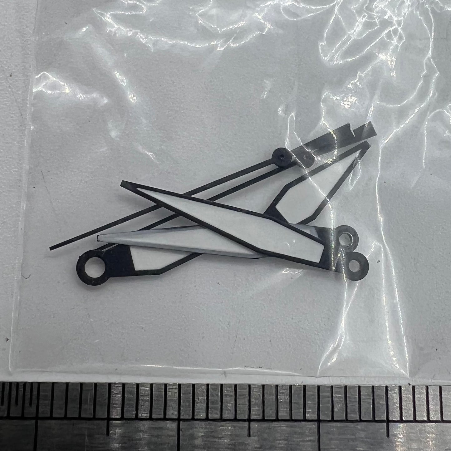 White diamond-shaped orange lume watch hands for ETA2836/2846/2824 movements, enhancing visibility and style.