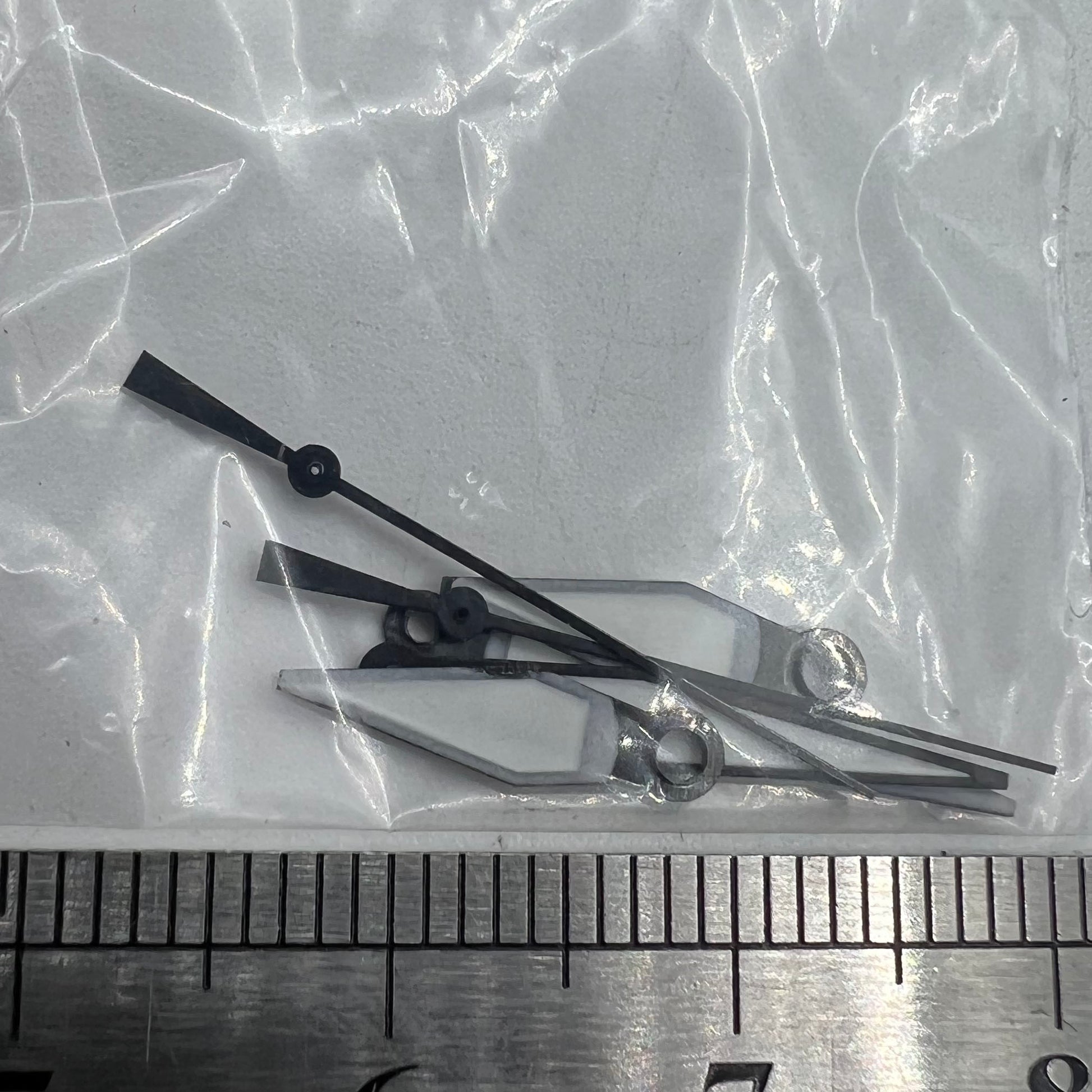 White+diamond orange lume watch hands for ETA2836/2846/2824/2846 movements, precise and durable accessory.