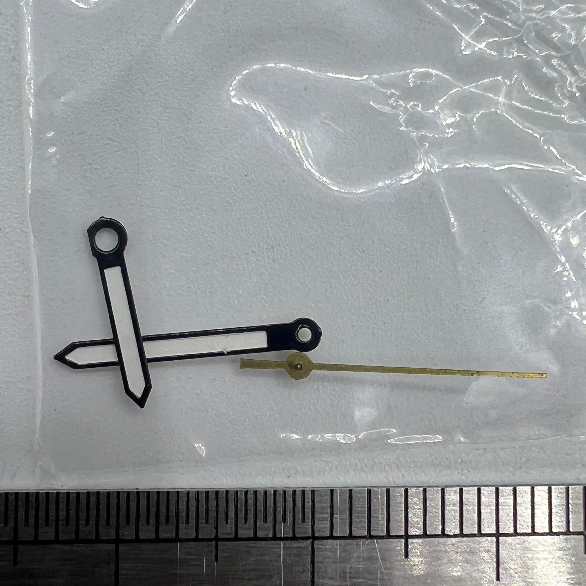 Luminous black trim watch hands by P1-H4-C99 for Miyota 2035 movement, enhancing style and visibility.