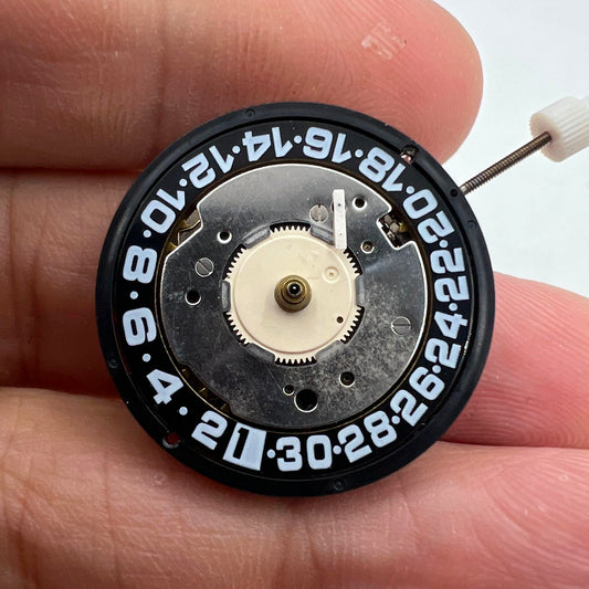 Original ISA8176A quartz watch movement with black dial, Swiss made, ideal for watch repairs and accessories.