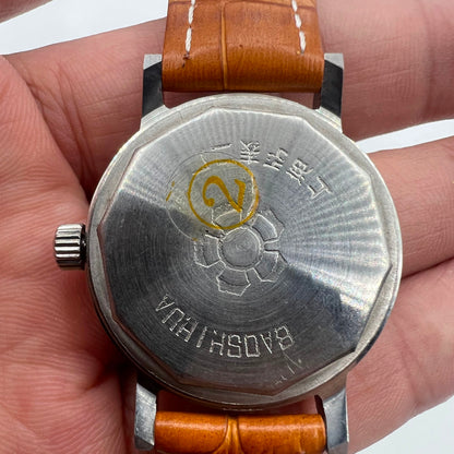 Shanghai 33mm manual mechanical watch with single calendar, 17 jewels, shock-resistant design for everyday wear.