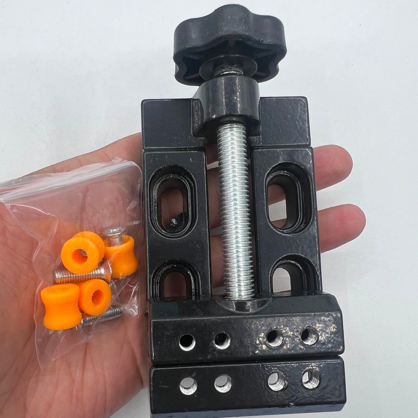 Mini electric drill with flat vice and clip clamp, perfect for detailed watch accessory repairs.