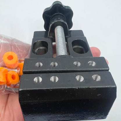 Mini electric drill with flat vice and clip table clamp for precise jewelry work.