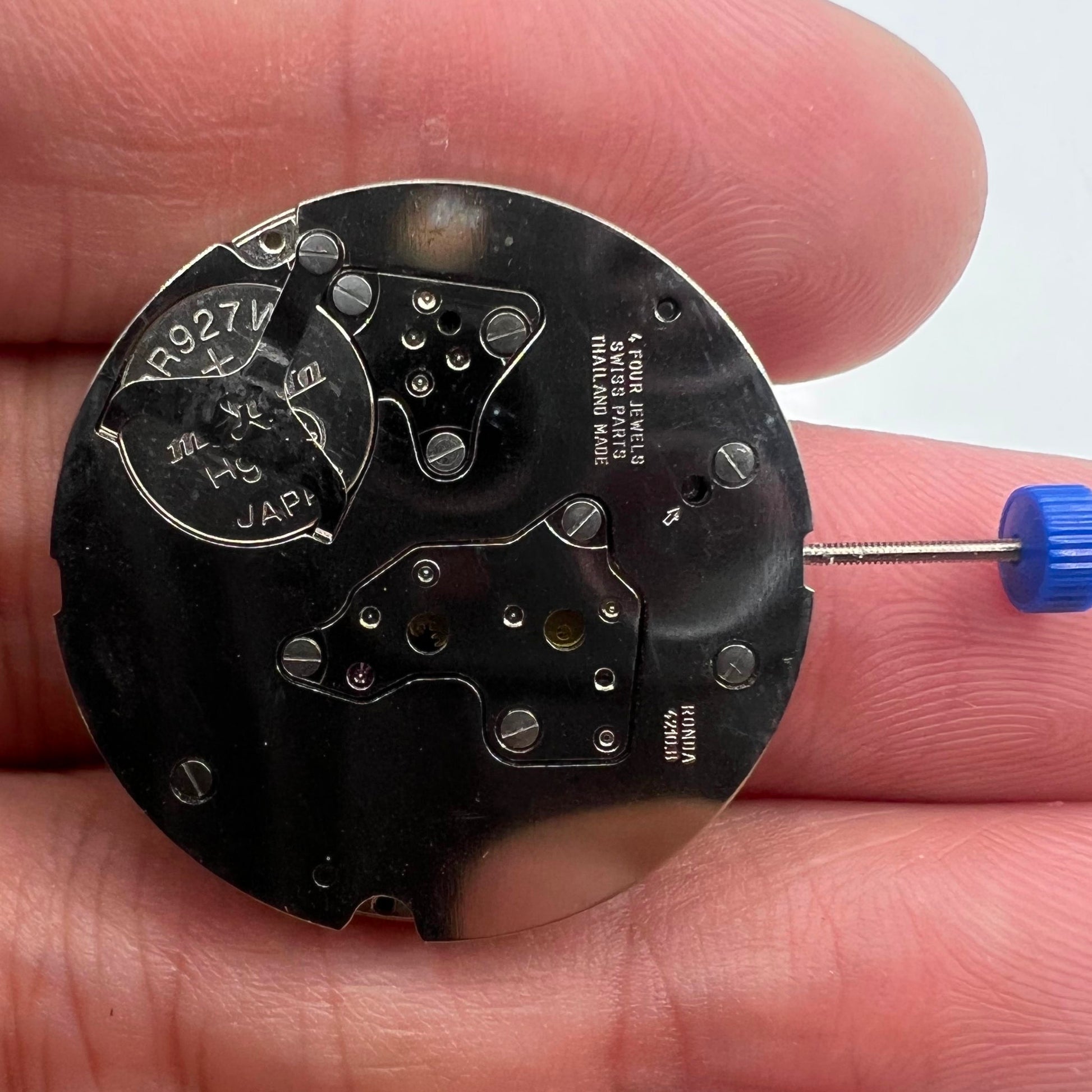 Ronda 4120B Quartz watch movement with black disk wheel for precise timekeeping.