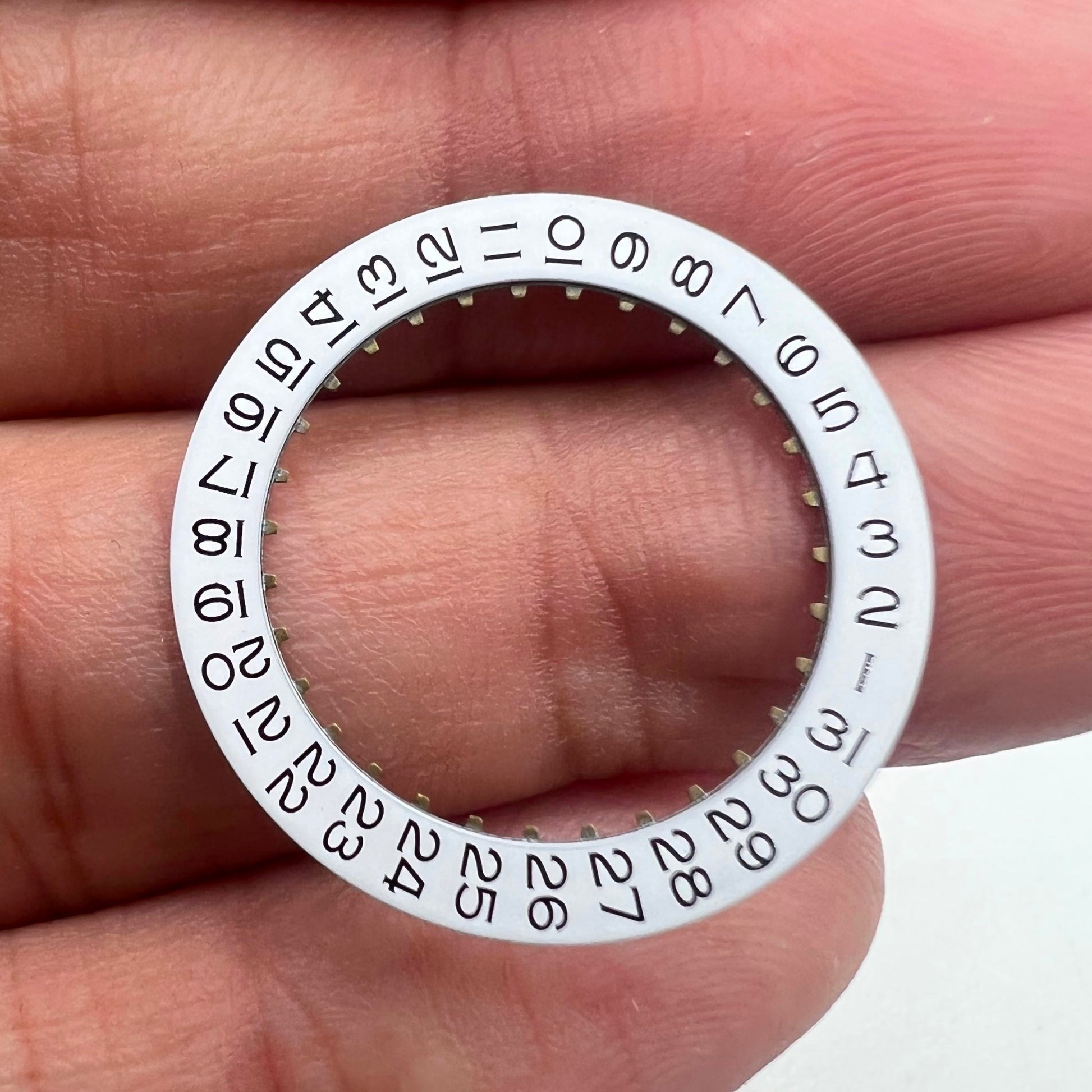 White date disk wheel with black font for ETA2836 movement, date display at 3 o'clock position.