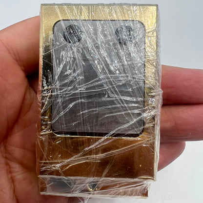 Brass and stainless steel pegwood tool by Woodcutter for precise watch repair and cleaning.