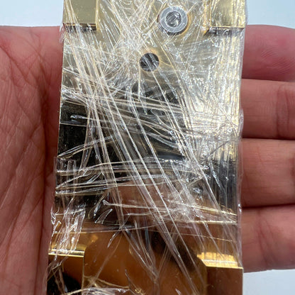 Woodcutter brass and stainless steel pegwood tool for precise watch cleaning and repair.