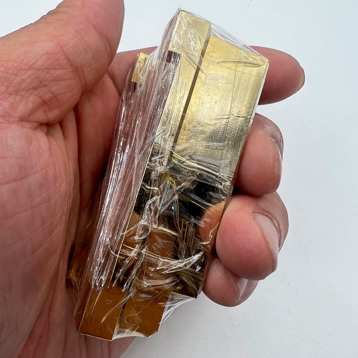 Brass and stainless steel pegwood tool by Woodcutter for precise watch cleaning and repair tasks.