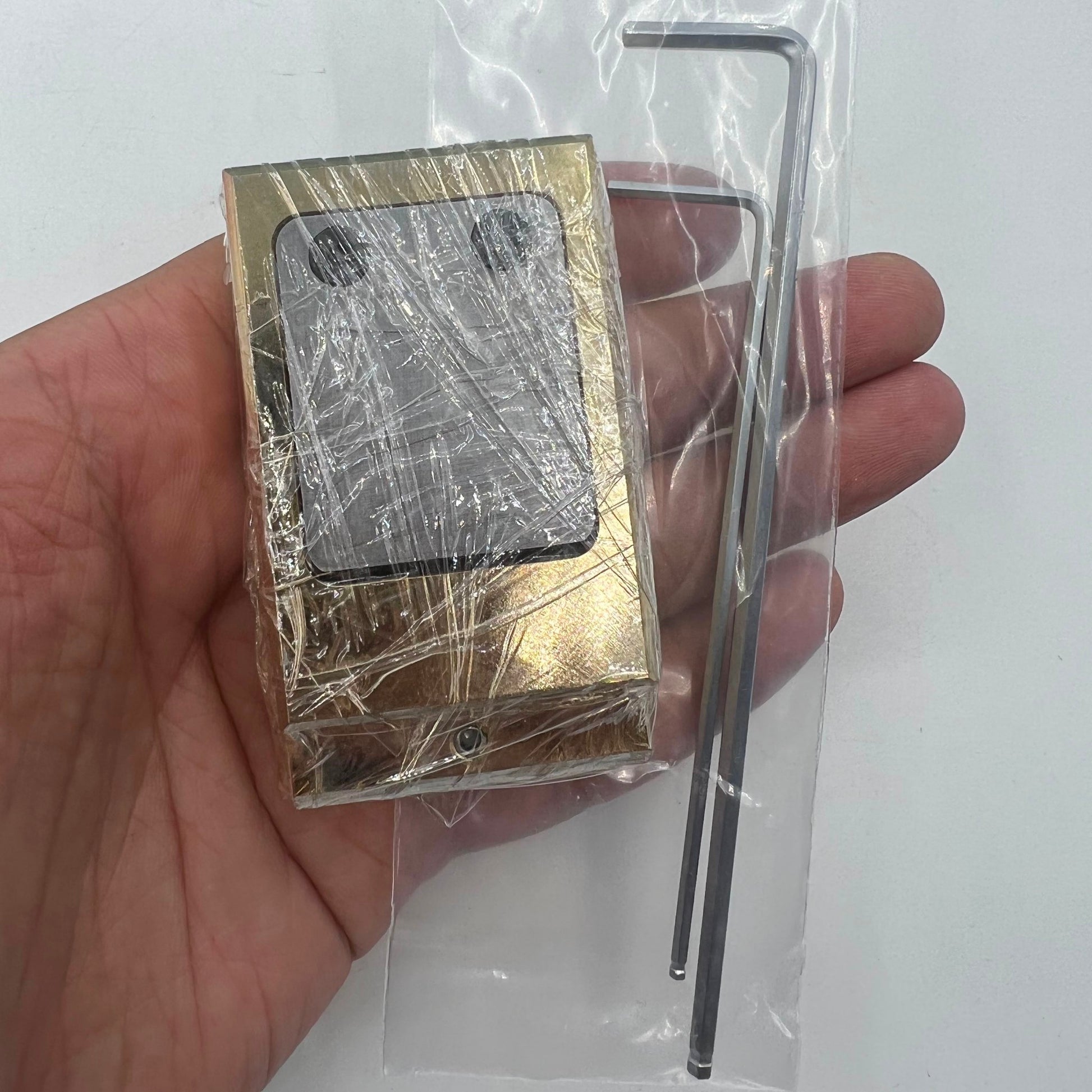 Woodcutter brass and stainless steel pegwood tool for precise watch repair and cleaning tasks.