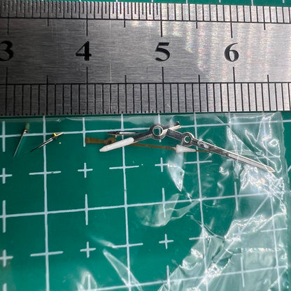 Silver and black 13mm luminous watch hands for Miyota OS series, enhancing visibility and style.