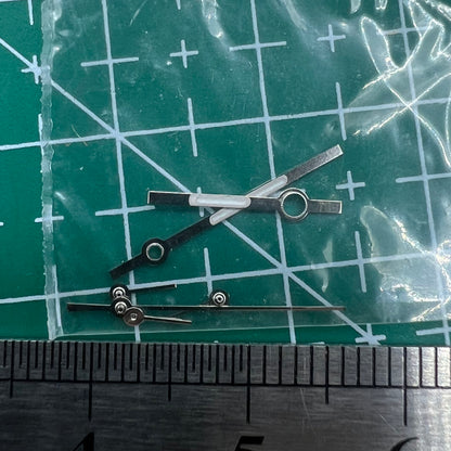 Silver watch hands with trim for Ronda 5030.D quartz movement, ideal for precision watch repairs.