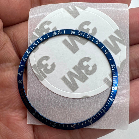 Uhrenlünette aus Aluminiumlegierung, blauer Ring + weiße + orange Schrift für Omega Speedmaster