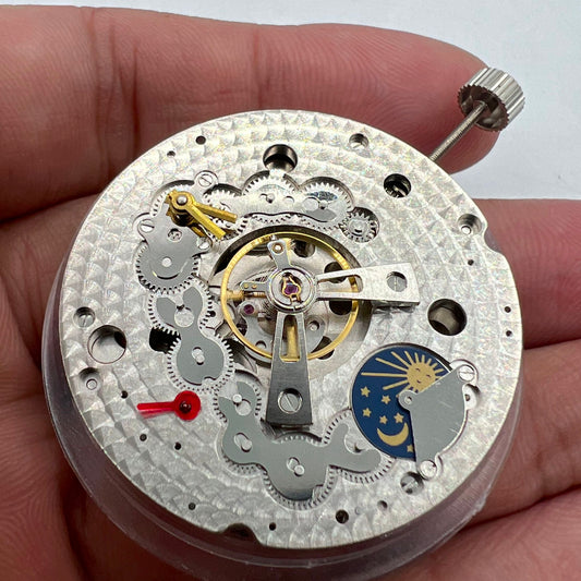Dandong Silver watch with hollow star moon phase and automatic mechanical movement details.