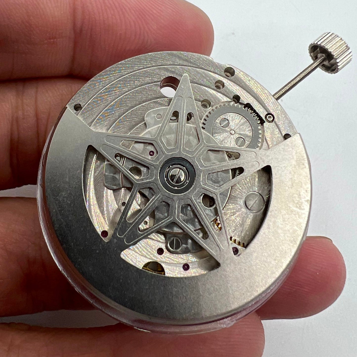 Dandong Silver watch showing hollow star moon phase and automatic mechanical movement close-up.