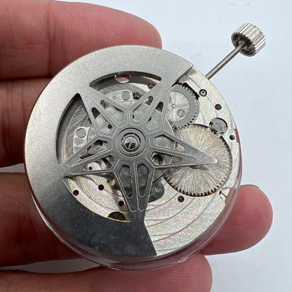 Dandong Silver watch showcasing hollow star moon phase with automatic mechanical movement, elegant design.