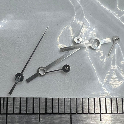Silver watch hands set by P1-H5-NO18, compatible with Ronda 5030.D quartz movement for precise timekeeping.