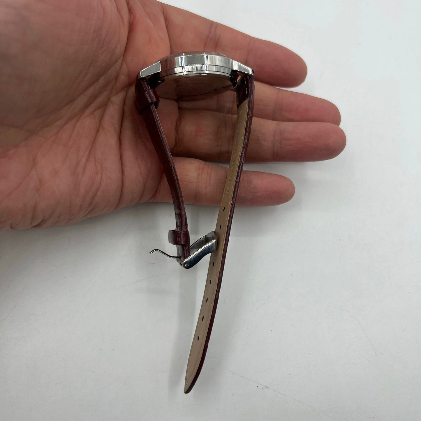 37mm China Baihua manual watch with silver dial, 19 jewels, shock-resistant mechanical movement for precise timekeeping.