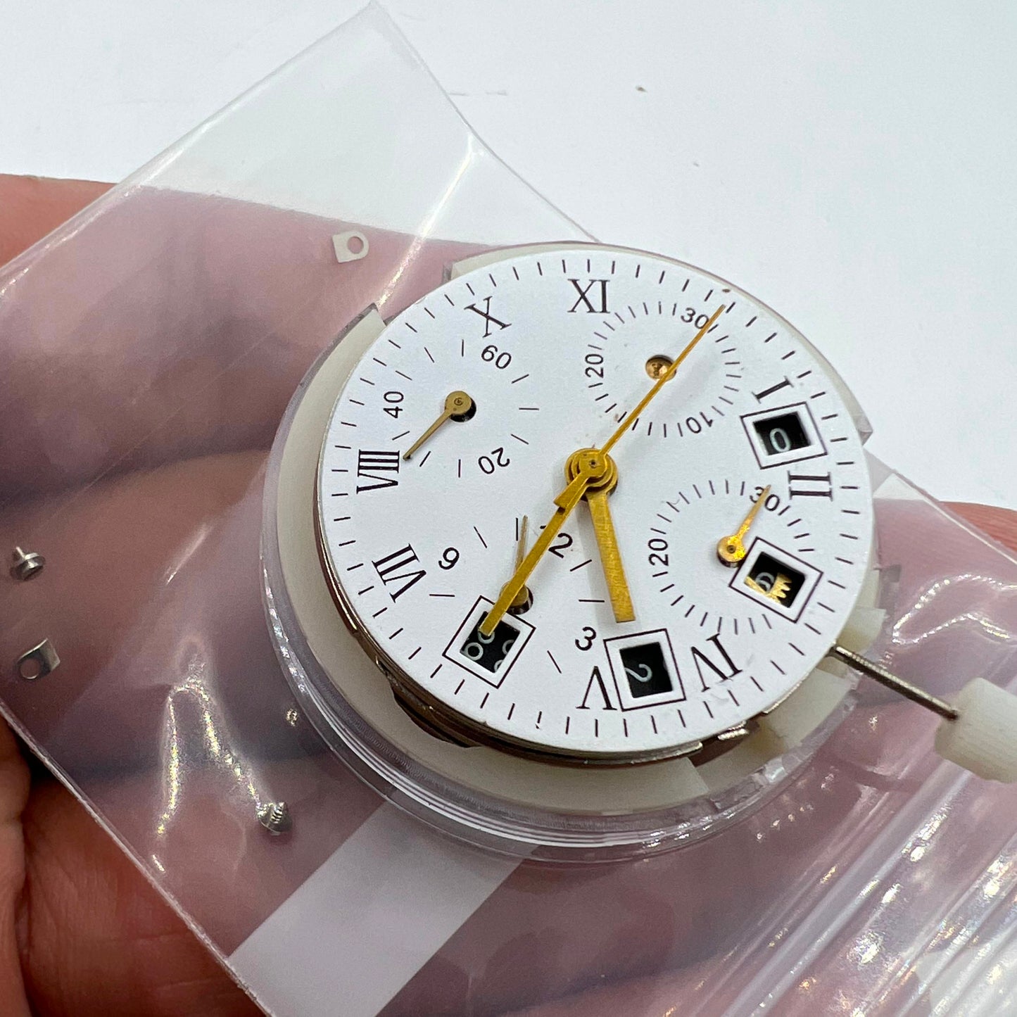 Automatic chronograph watch with Asian 7750 movement, black dial, and calendar at 4.5, seconds at 9 - branded.