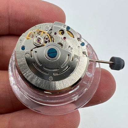 DG2813 watch movement with three large hands and small seconds at 6 o'clock, no calendar feature.