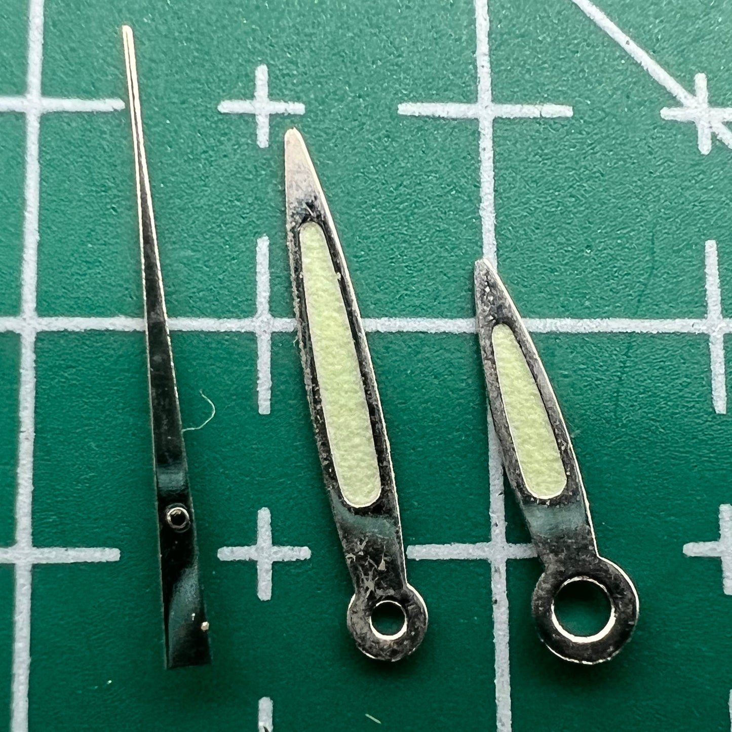 Arrow-shaped green luminous watch hands set for Miyota 2035 movement, boosting visibility and style.