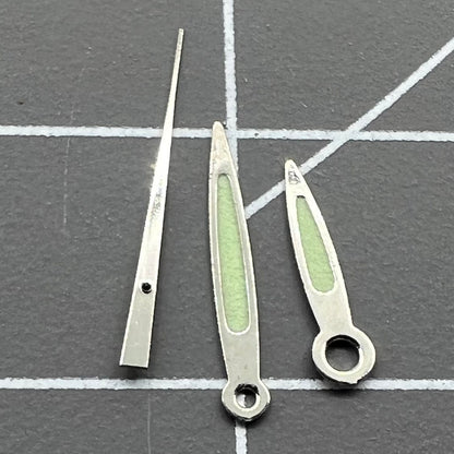 Arrow-shaped green luminous watch hands set for Miyota 2035, 2115, 2105, 2305 movements, enhancing visibility.