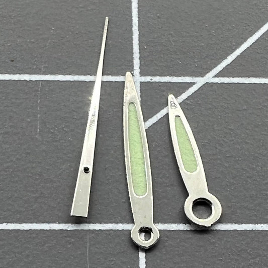 Arrow-shaped green luminous watch hands set for Miyota 2035, 2115, 2105, 2305 movements, enhancing visibility.