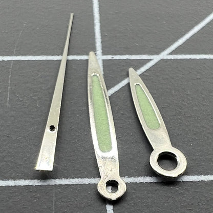 Arrow-shaped green luminous watch hands set for Miyota 2035, 2115, 2105, 2305 movements, enhancing visibility.