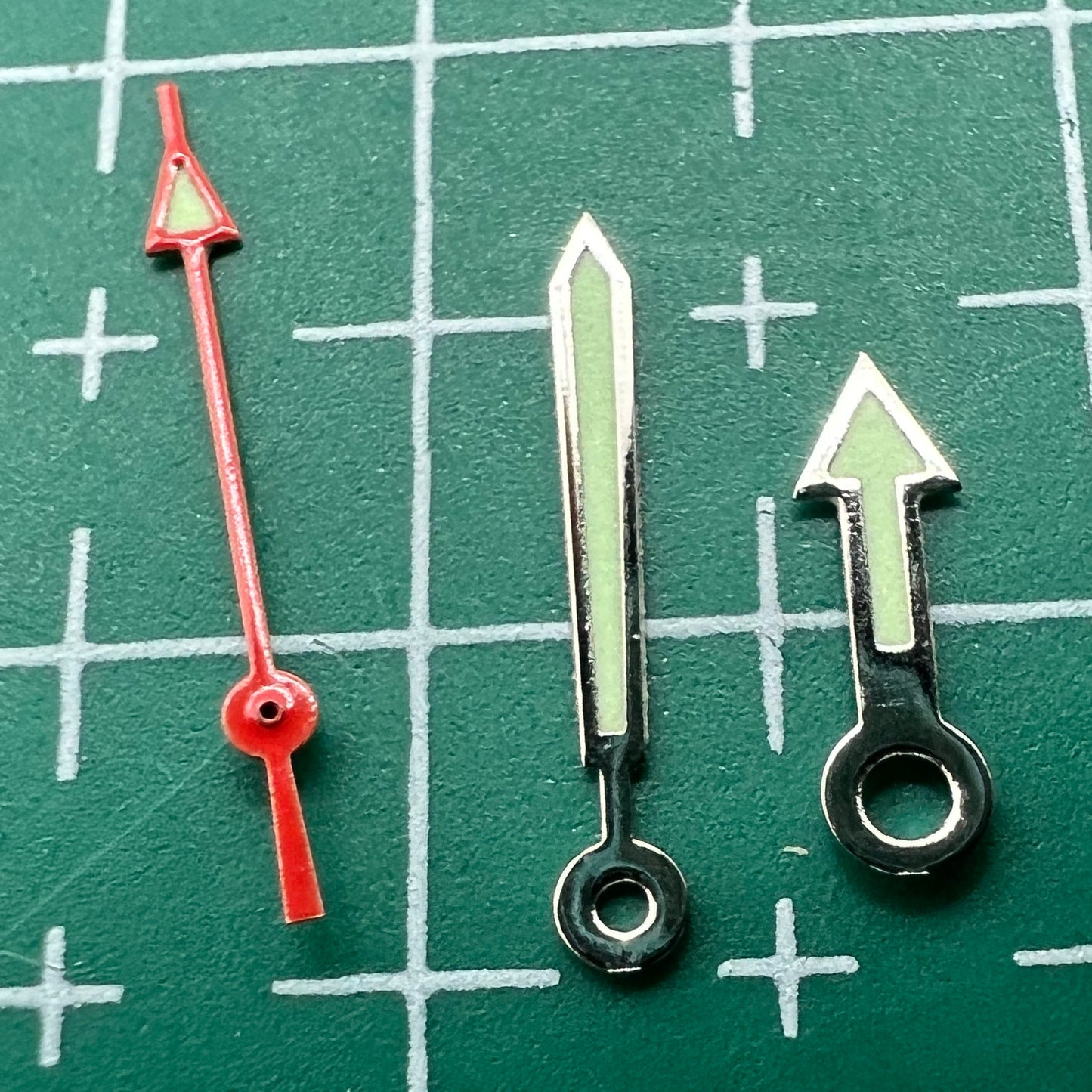 Green luminous arrow-shaped watch hands set by Miyota, fits models 2035, 2115, 2105, 2305, improving time visibility.