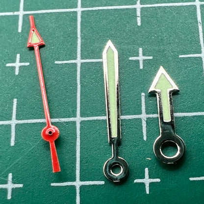 Green luminous arrow-shaped watch hands set by Miyota, fits models 2035, 2115, 2105, 2305, improving time visibility.