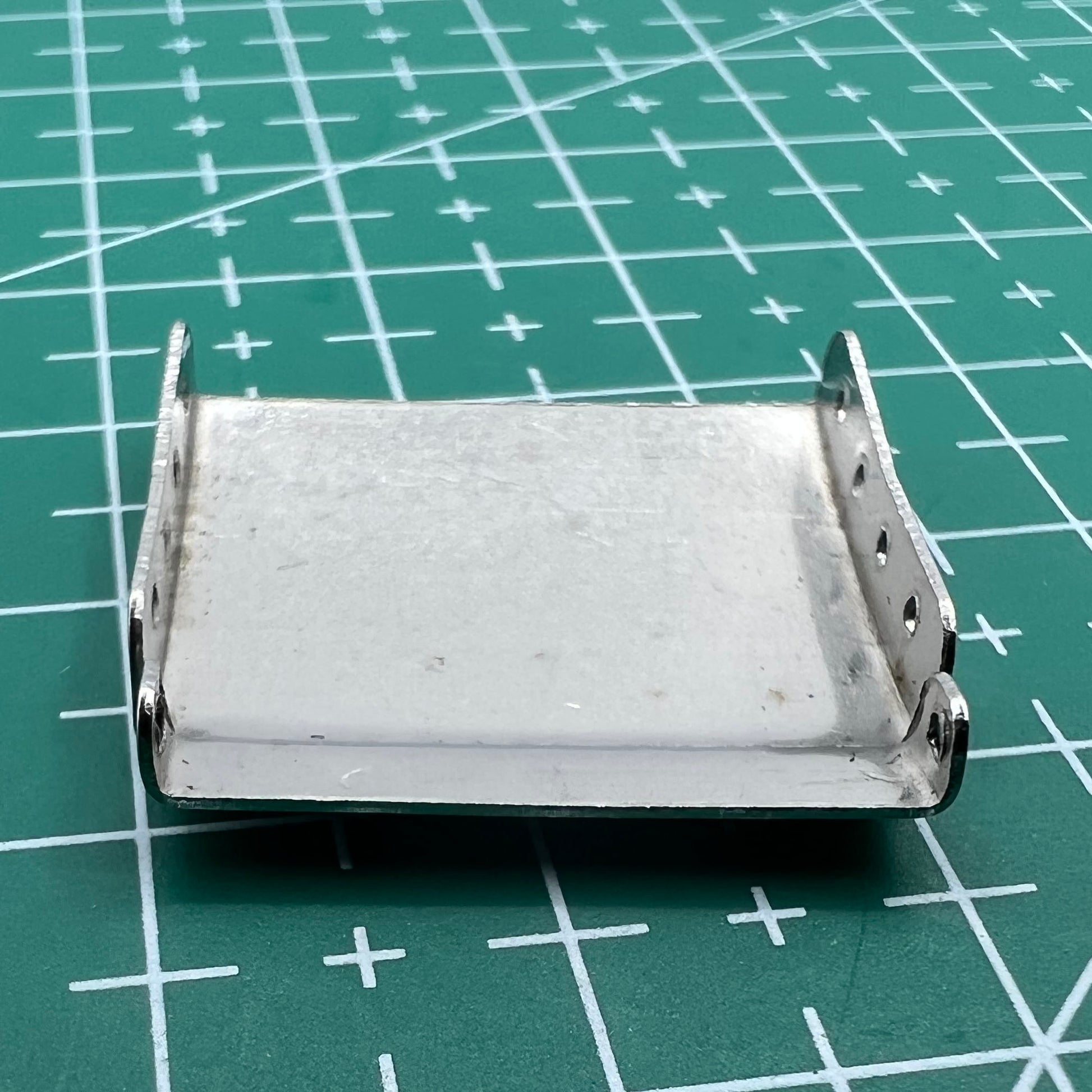 Set of 14 silver watch strap extenders with clasps for customizable bracelet length adjustment.