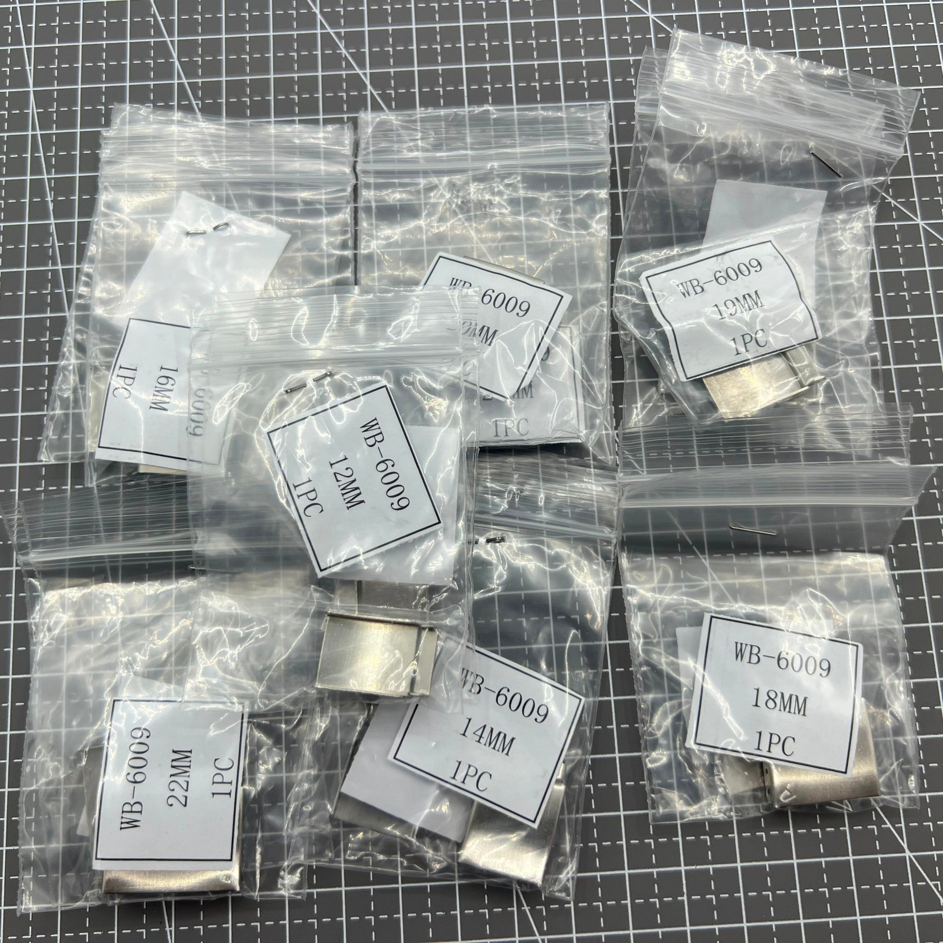 Silver watch strap extenders with secure clasps, perfect for customizing bracelet fit.